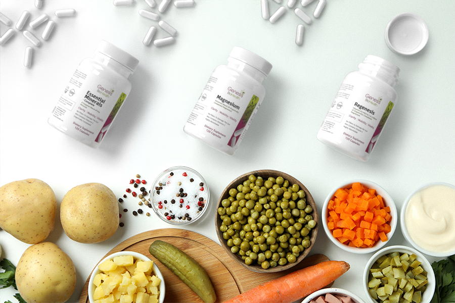 Magnesium, regenesis and Essential minerals bottles with specialty supplements pills. Also, potatoes, carrots and salt